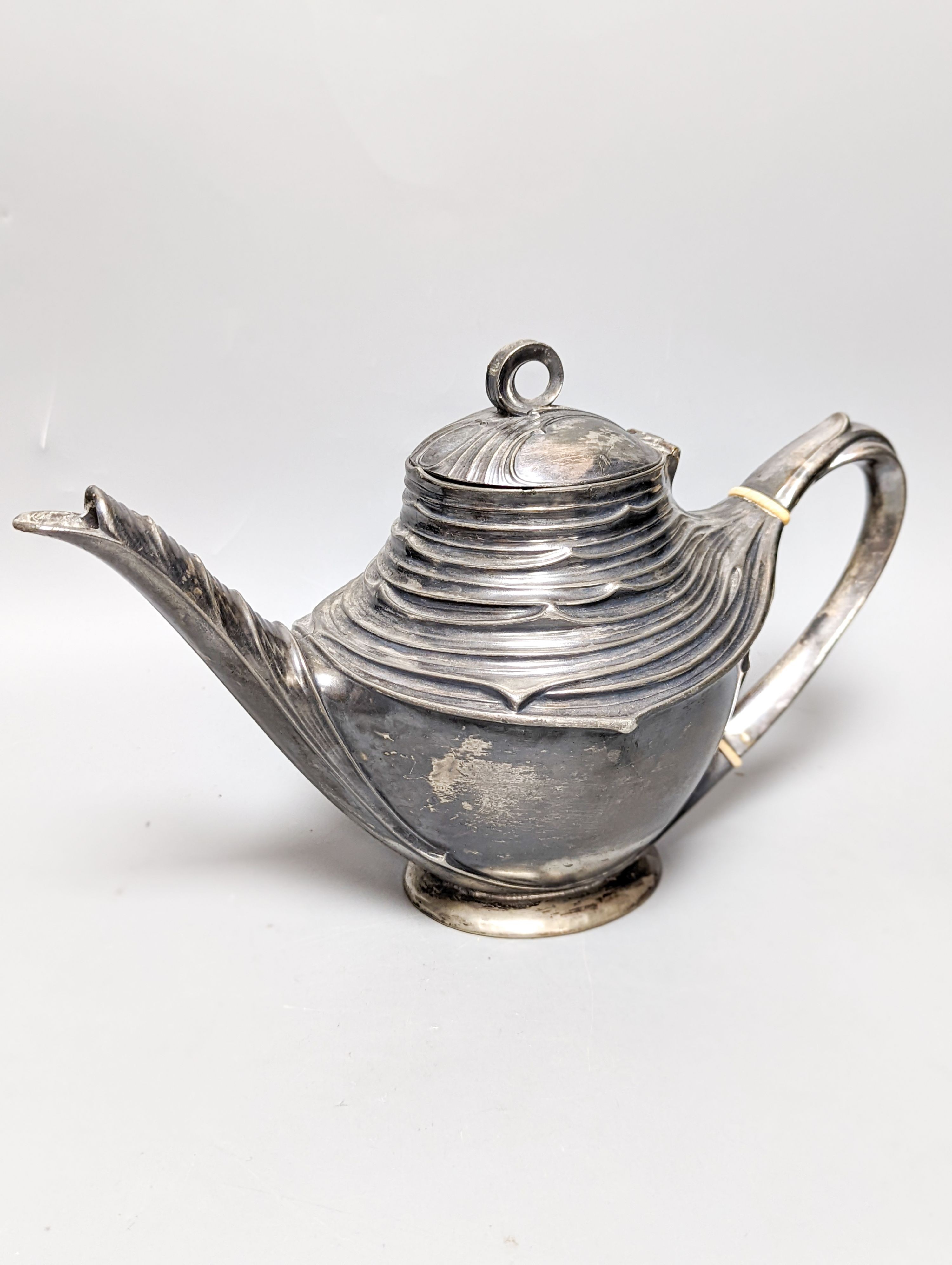 A WMF pewter teapot, an early 20th century bronze of Venus with dolphin, 2 other figures and a WMF style figural desk stand 36cm